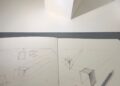 Cuaderno de dibujo con un boceto a lápiz para practicar cómo dibujar en perspectiva